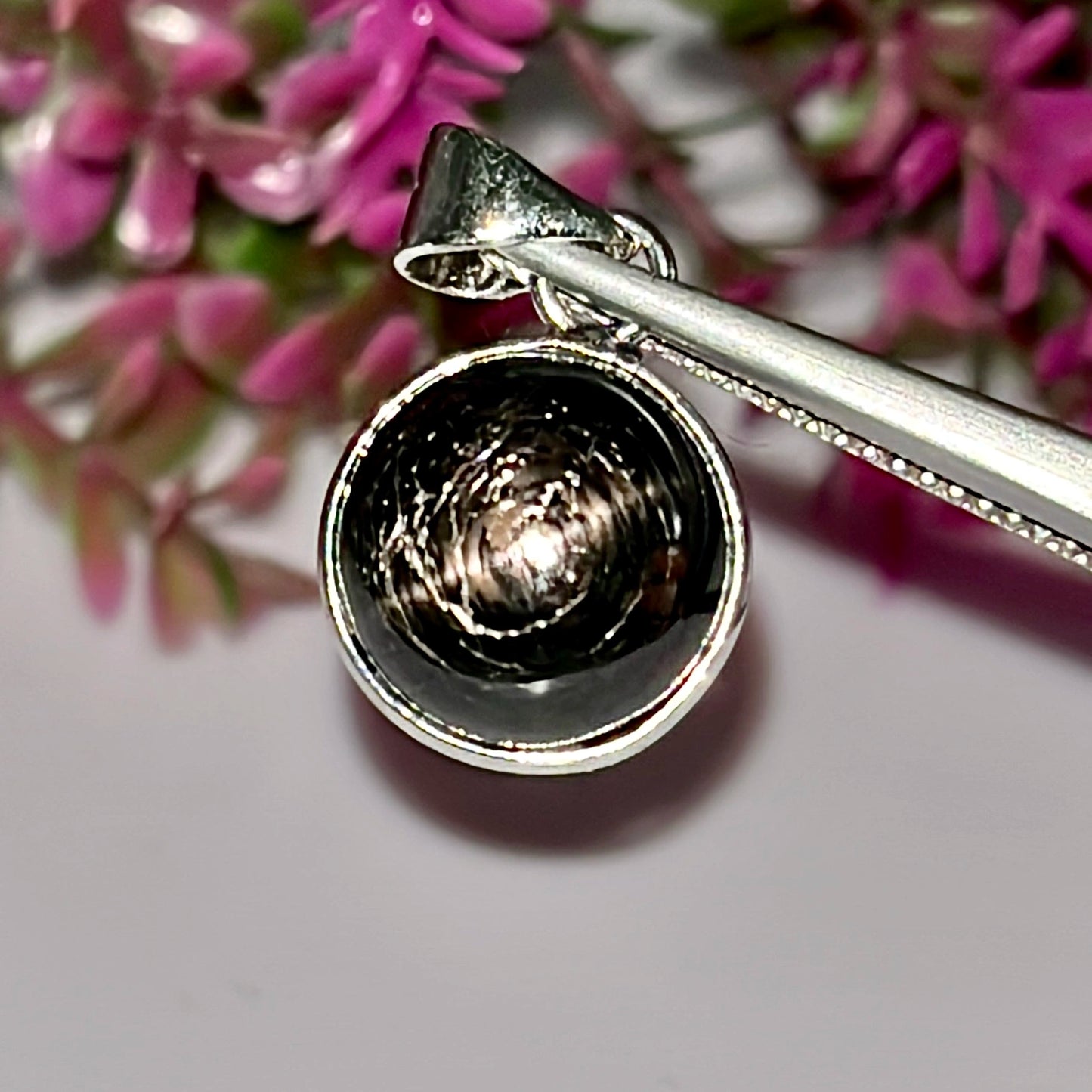 Hanger met natuurlijke zwarte steredelsteen en rhodiumplating